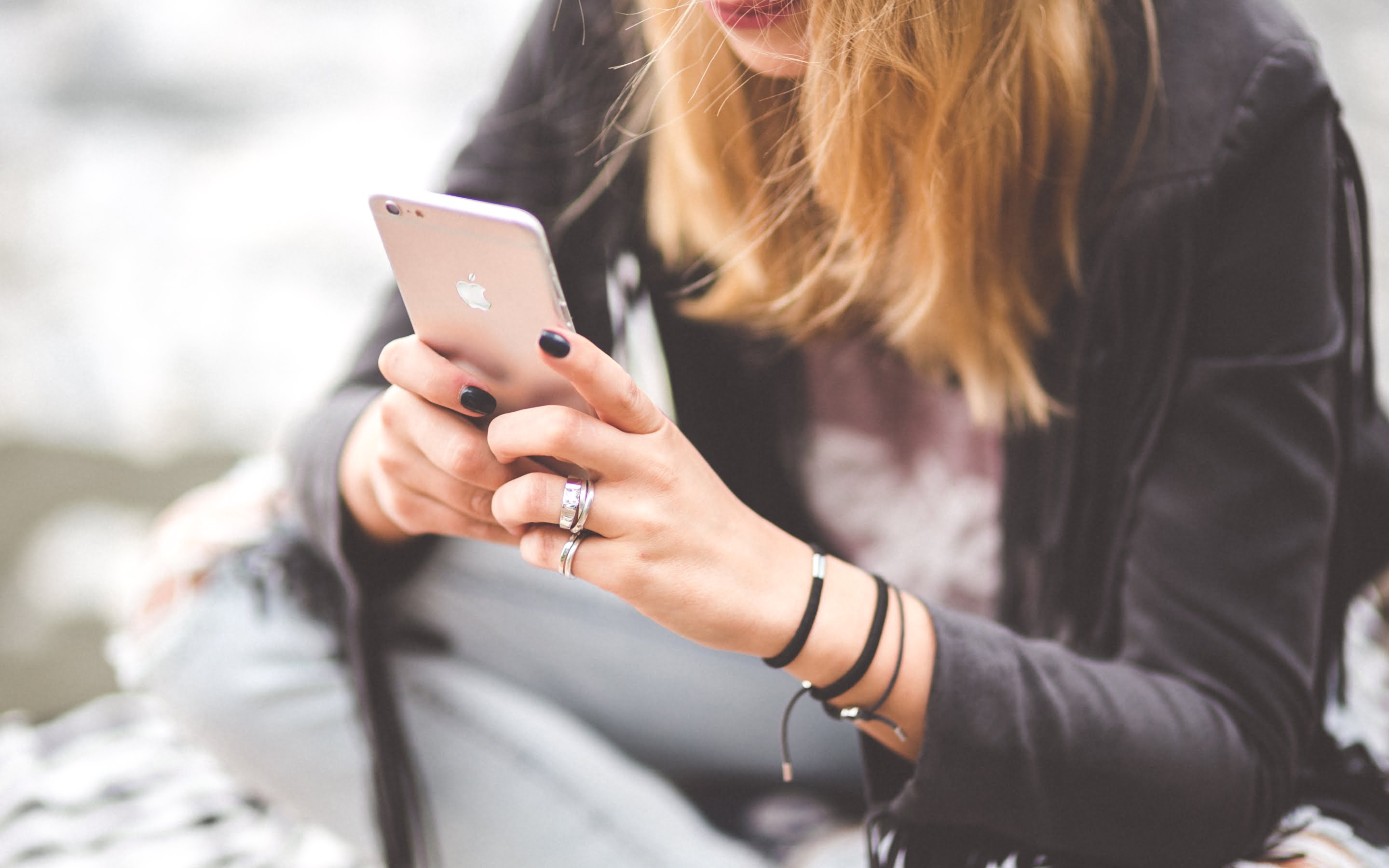 girl using iphone mobile